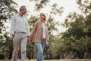 Couple holding hands on a walk in nature 